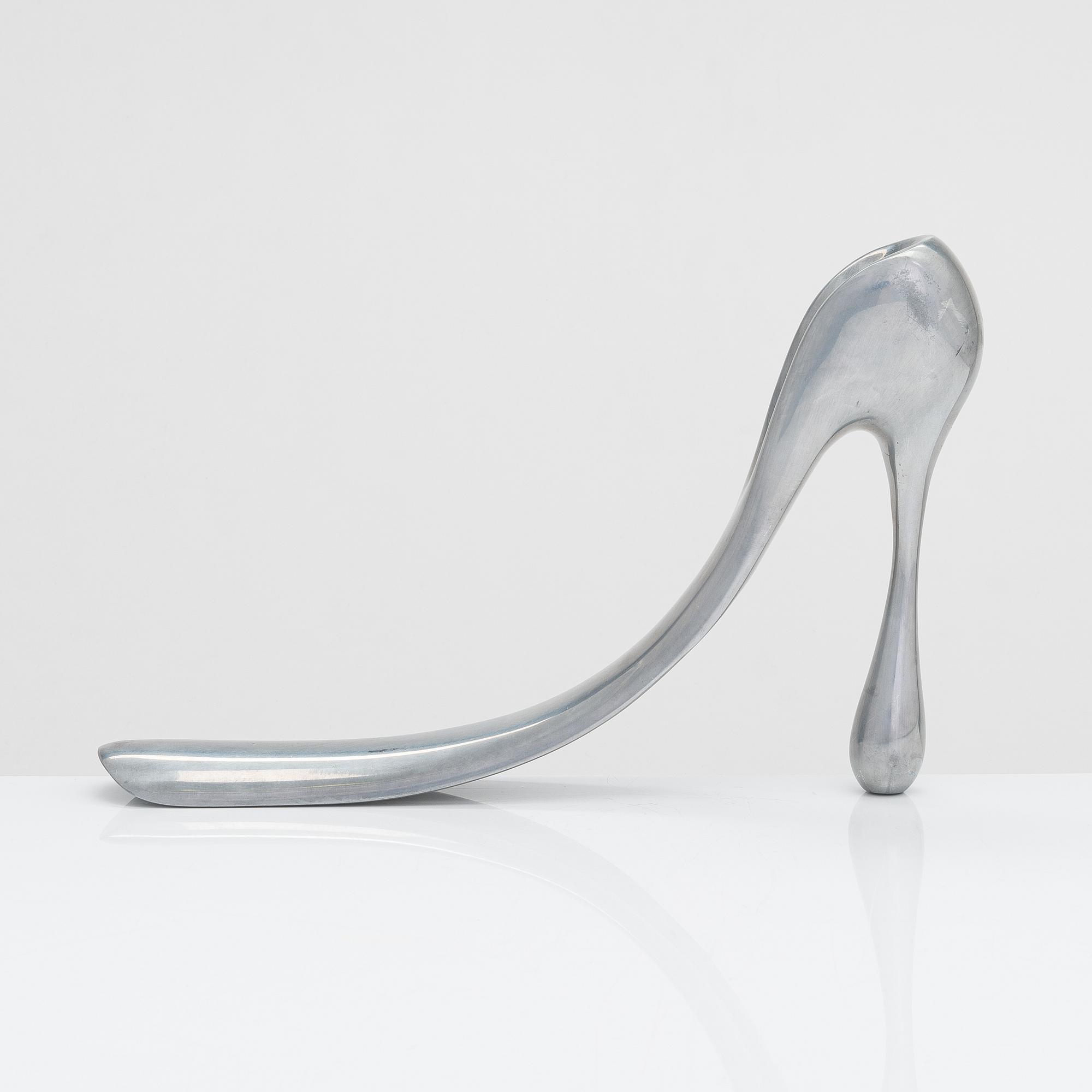 A metal shoe horn by Manolo Blahnik, 2000s.