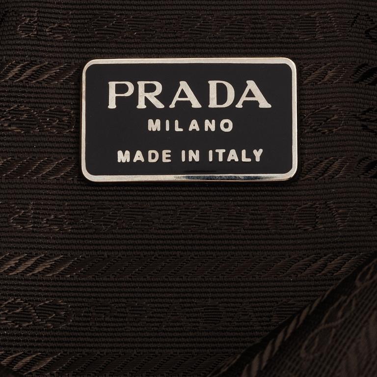 Prada, a tan suede bag.