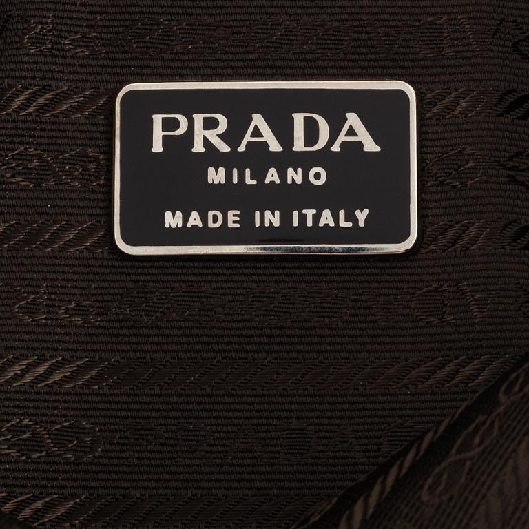 Prada, a tan suede bag.