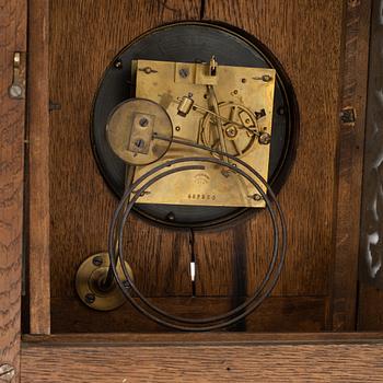 A wall clock, around the year 1900.