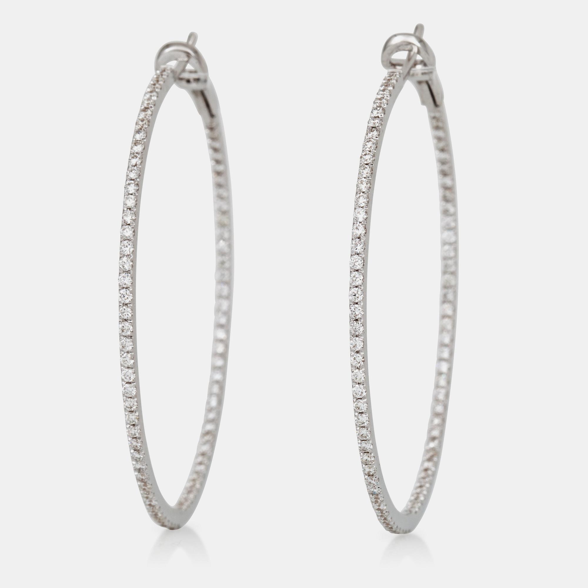 A pair of brilliant-cut diamond hoop earrings. Total carat weight circa 1.80 cts.
