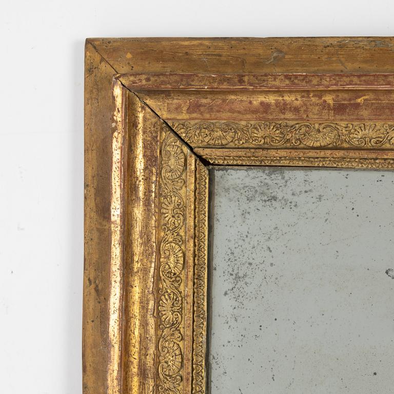 An Empire giltwood and gesso mirror/wall panel, first part of the 19th Century.