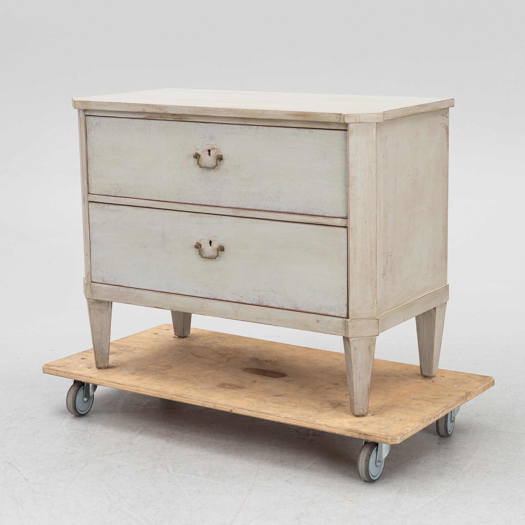 A chest of drawers, circa 1900.