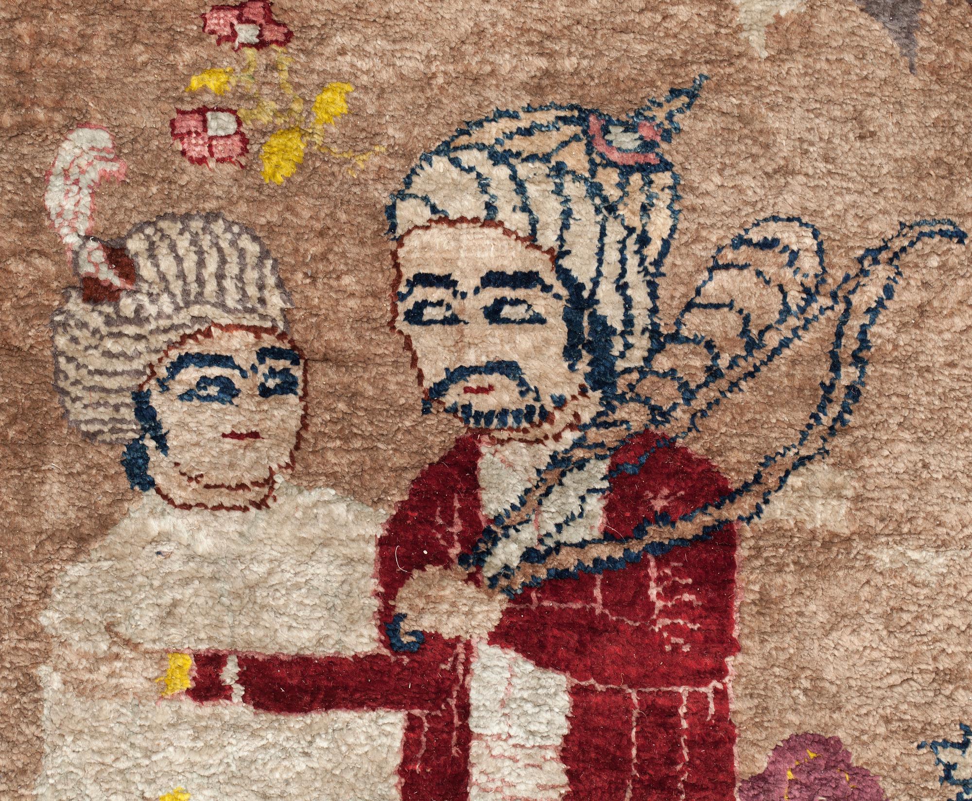 A CARPET, a semi-antique silk Tabriz figural, signed Haddad, 180,5 x 123,5 cm.