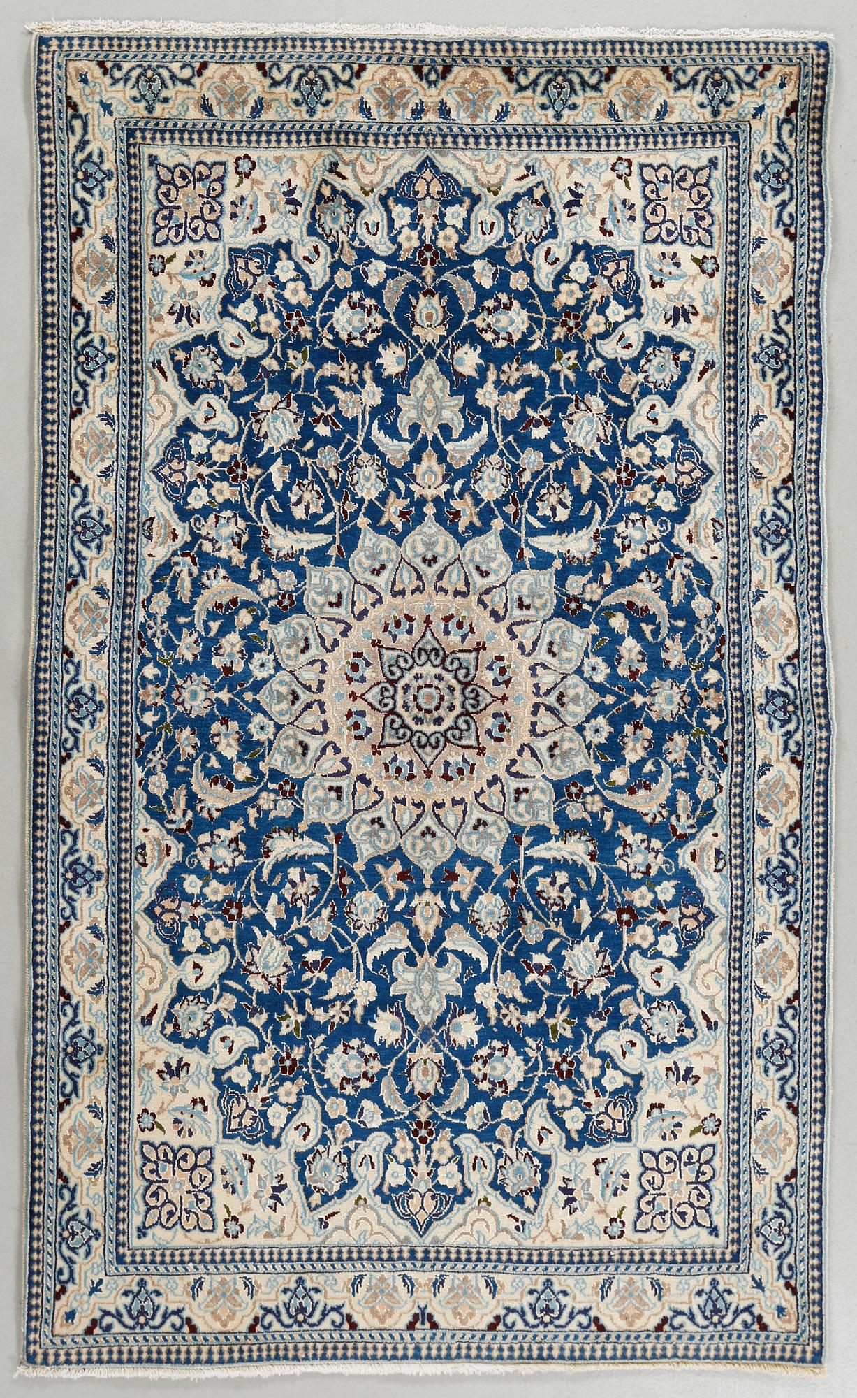A Nain rug, part silk, 183 x 110 cm.