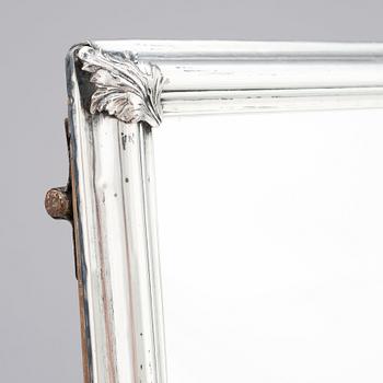 A probably mid-18th Century mirror with silver frame. Unmarked.