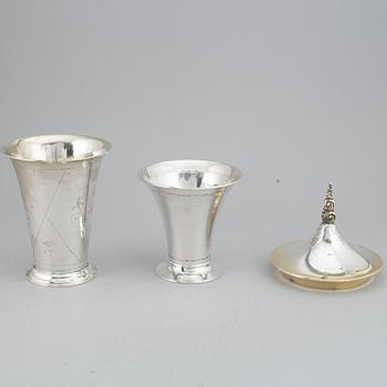 Two silver and parcel-gilt beakers and a parcel-gilt lid, maker's mark K. Andersson, Stockholm, 1927, 1922 and 1948.