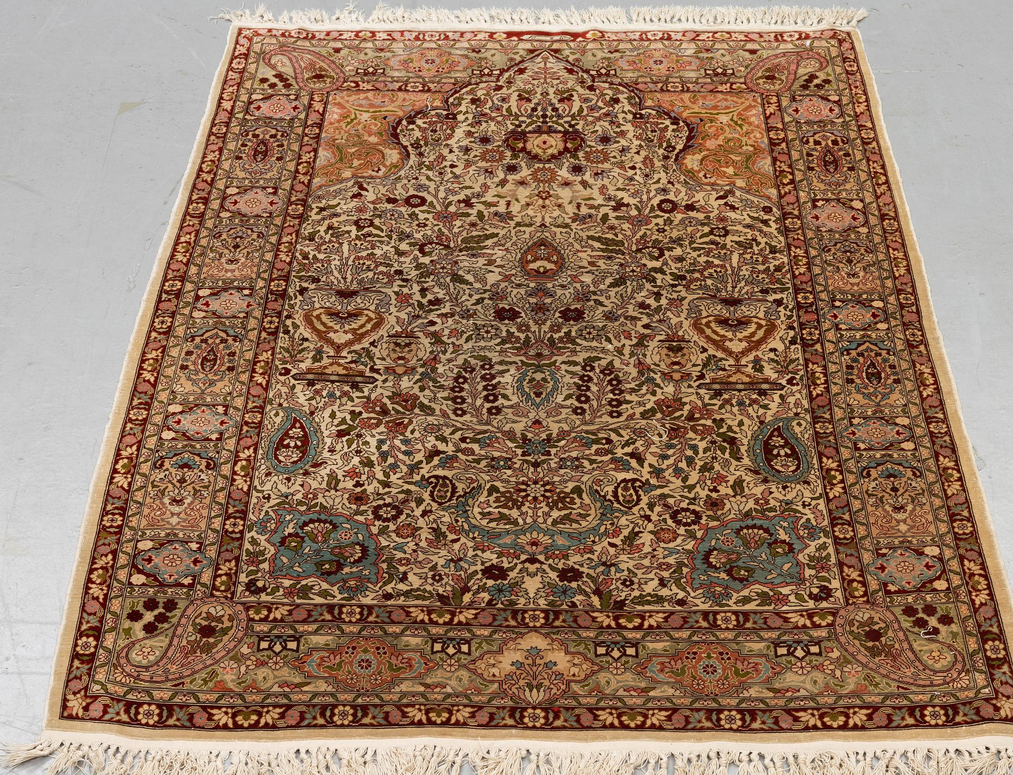 A rug, Old silk Hereke, ca 152 x 110 cm.