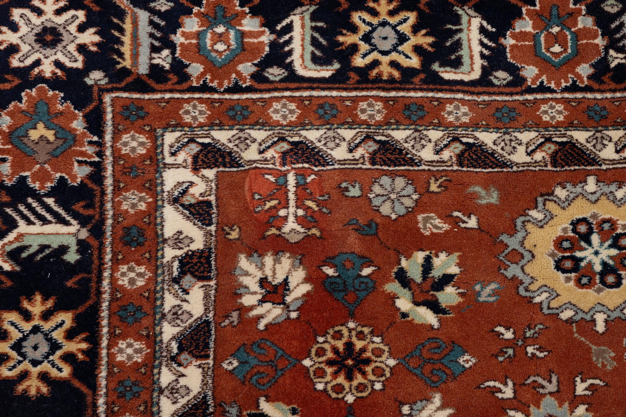 A semi-antique Orientall carpet c. 318 x 202 cm.