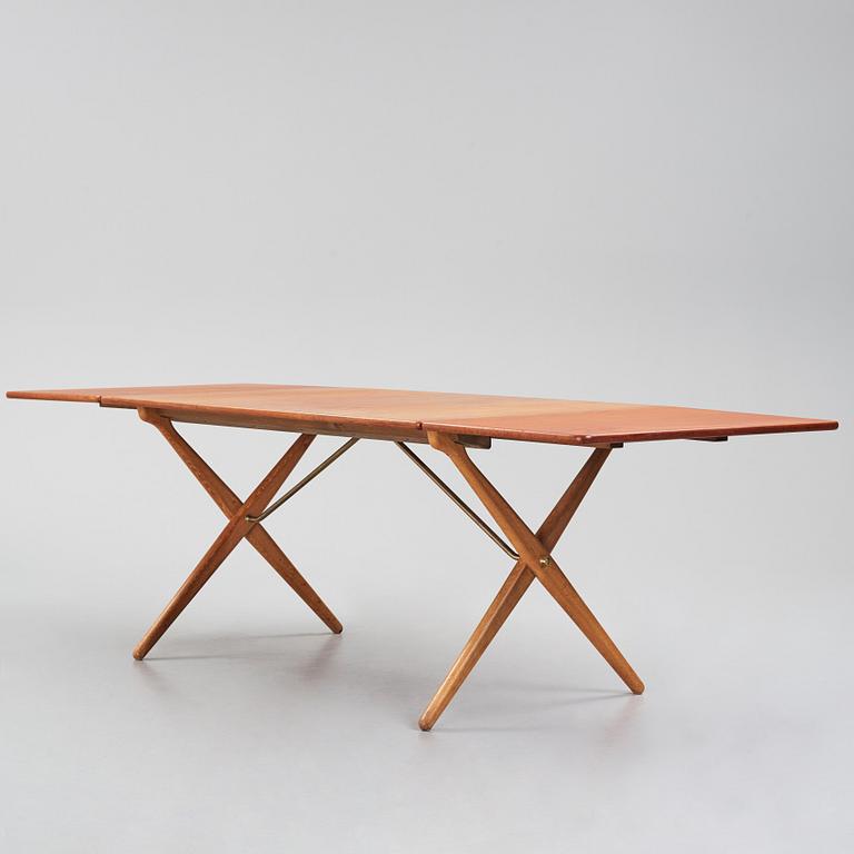 Hans J. Wegner, a teak and oak drop-leaf dining table, Andreas Tuck, Denmark 1950s-1960s.