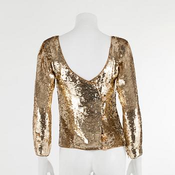 YVES SAINT LAURENT, a golden tinsel eveningjacket, size small.