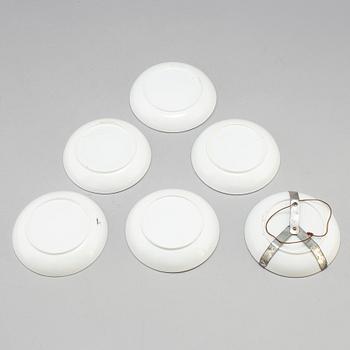 Six soft paste cups with saucers, early 19th century.