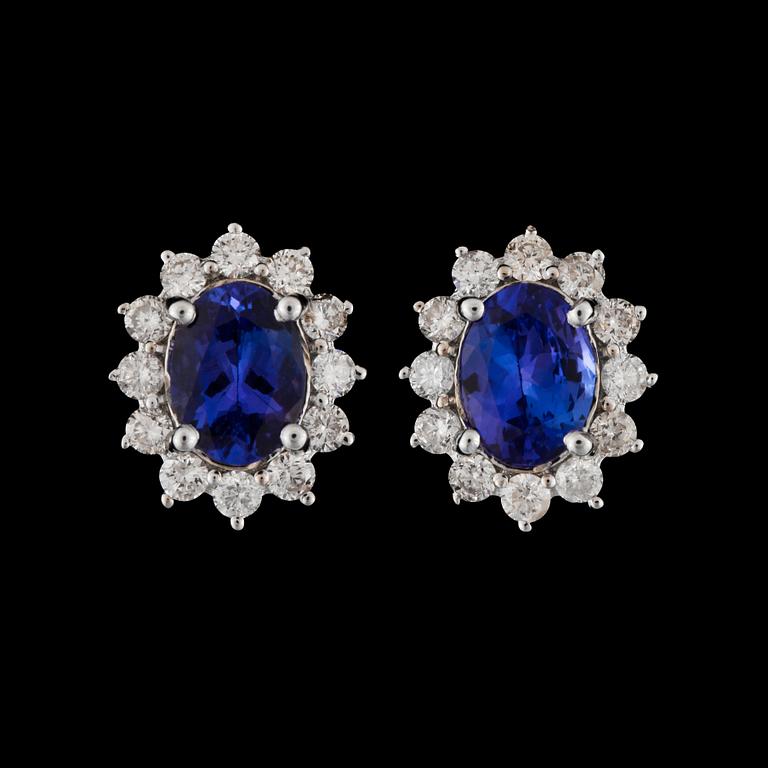A pair of tanzanite, total circa 2.95 cts, and diamond, total circa 1.00 ct, earring.