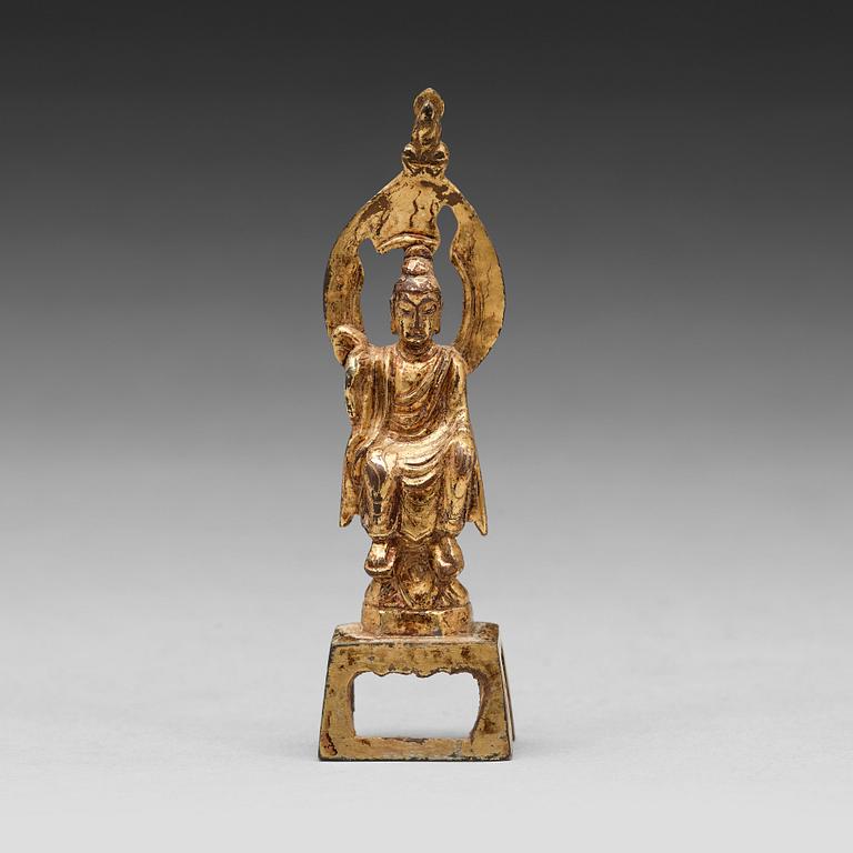 A gilt bronze figure of Buddha, presumably Tang dynasty (618-907).