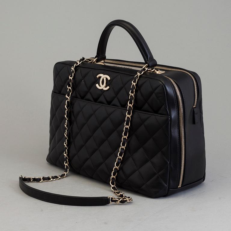 A black leather bag by Chanel 2014-2015.