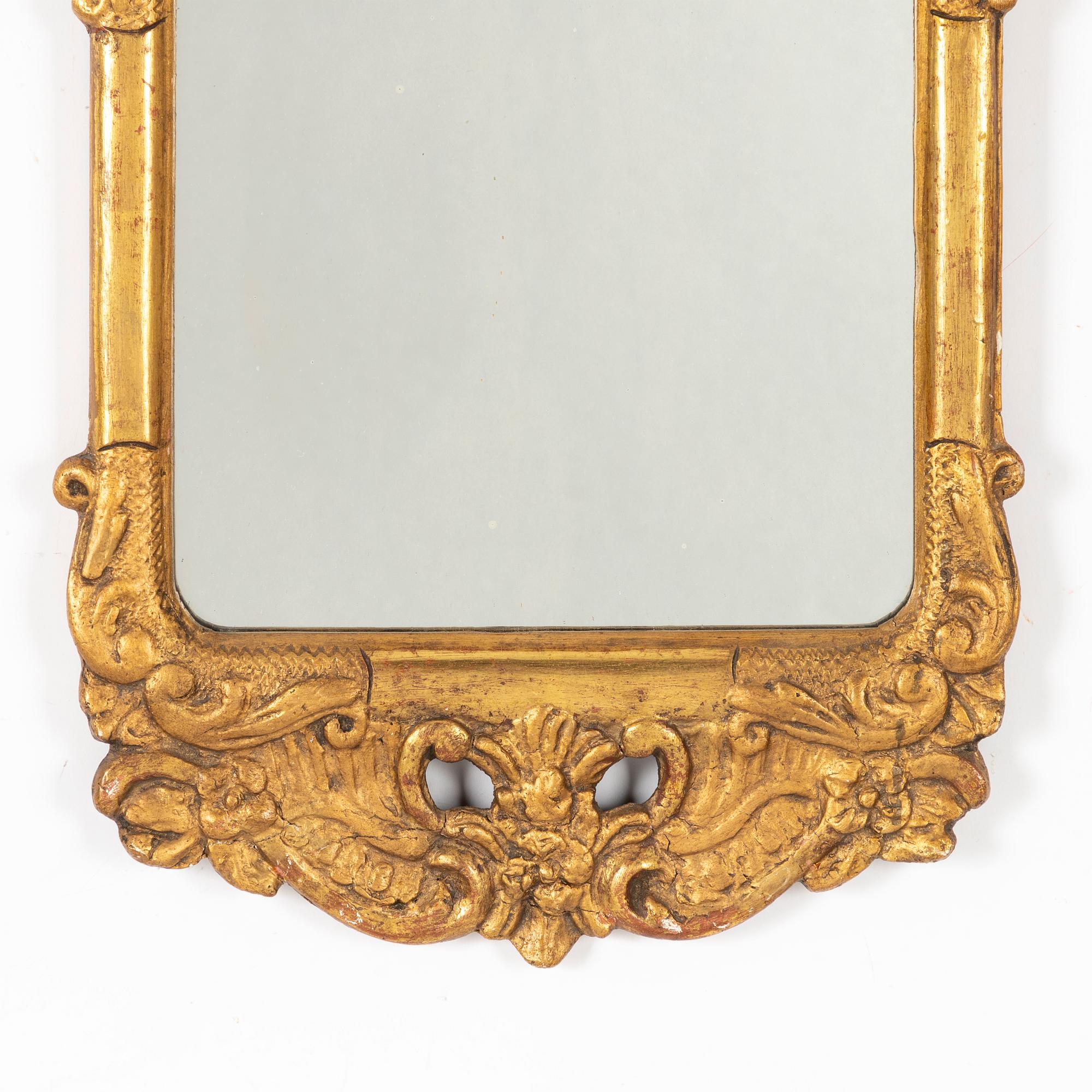 A Rococo mirror, 18th Century.