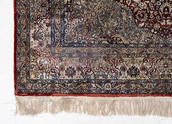 Carpet, part silk, approx. 240 x 158 cm.