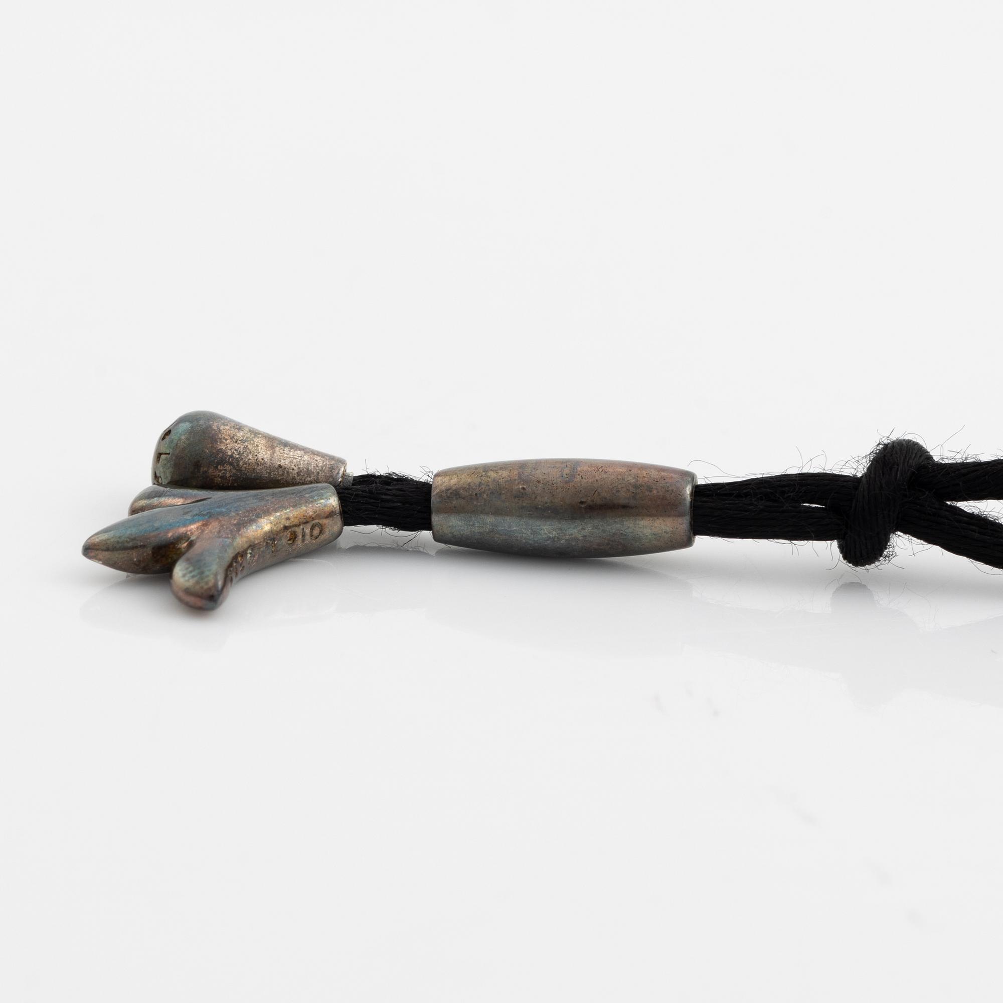 Ole Lynggaard, pendant, silver, with textile.