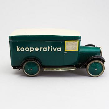 A tinplate biscuit jar in the shape of a truck 1930s.