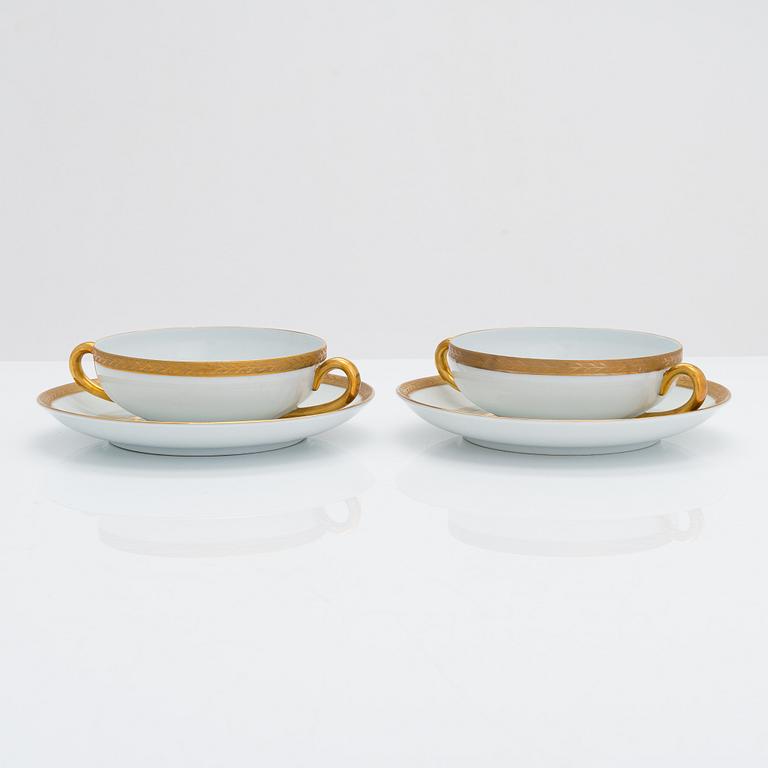 A 13-piece set of Arabia porcelain broth bowls with saucers, 1932-49.