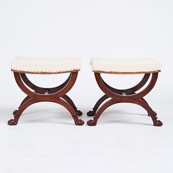 A pair of Directoire mahogany stools, circa 1800.