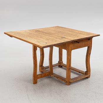 A 18th century gate-leg table.