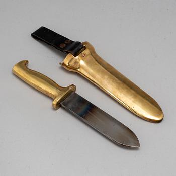 A brass diver's knife from C.E. Heinke & Co. Ltd., London, England.