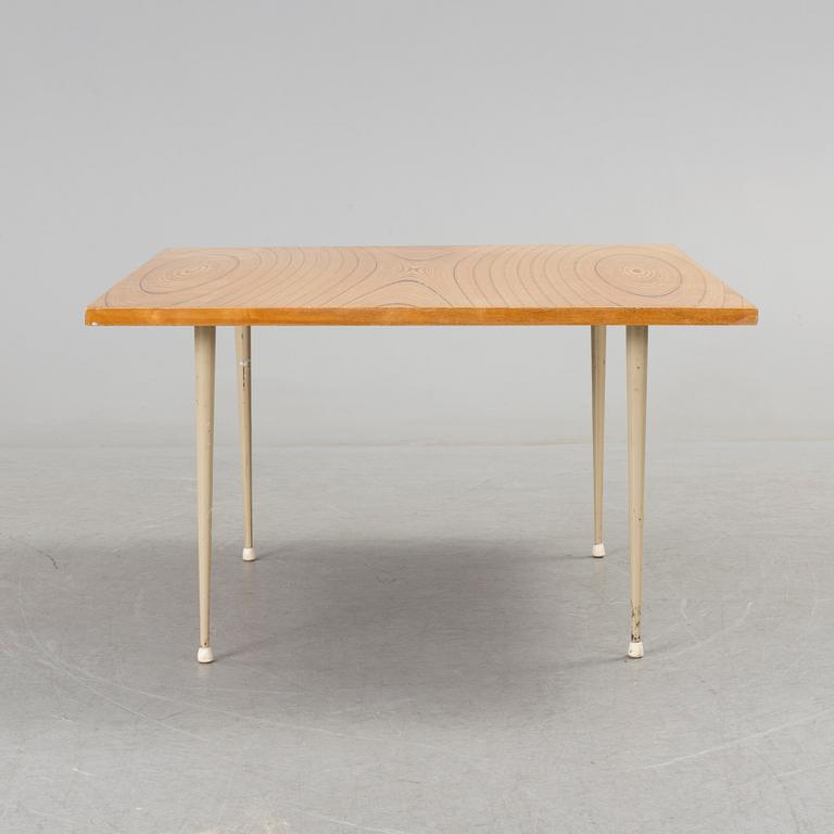 A coffee table marked Tapio Wirkkala, Asko, Made in Finland.