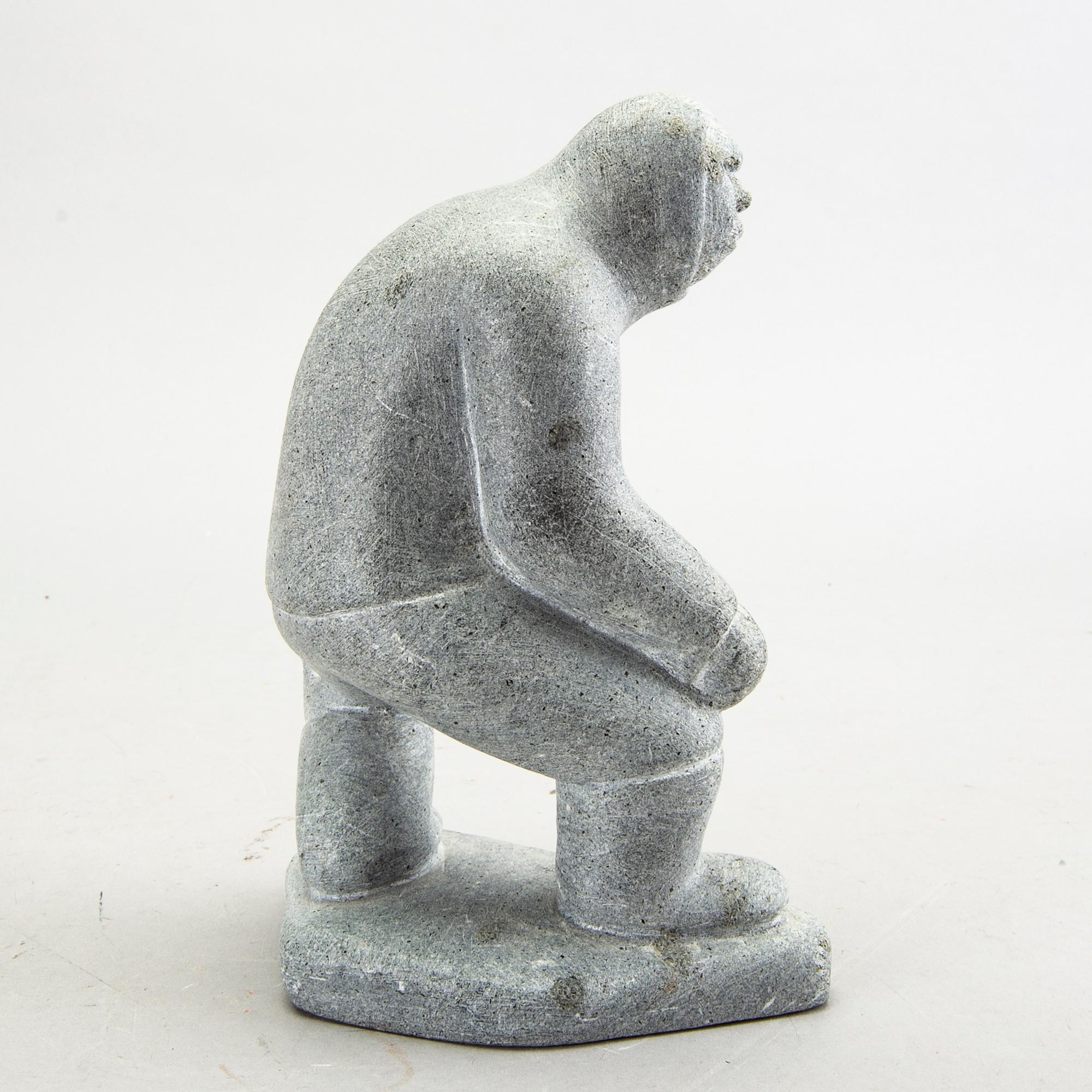 A simon Kristofferson signed stone figurine.