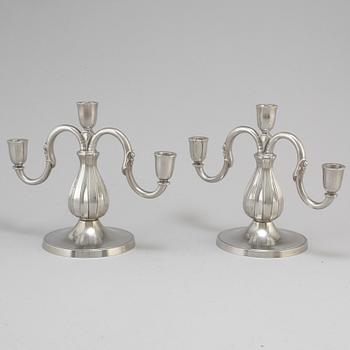 A pair of pewter candelabra from GAB Tenn, Stockholm, 1935.