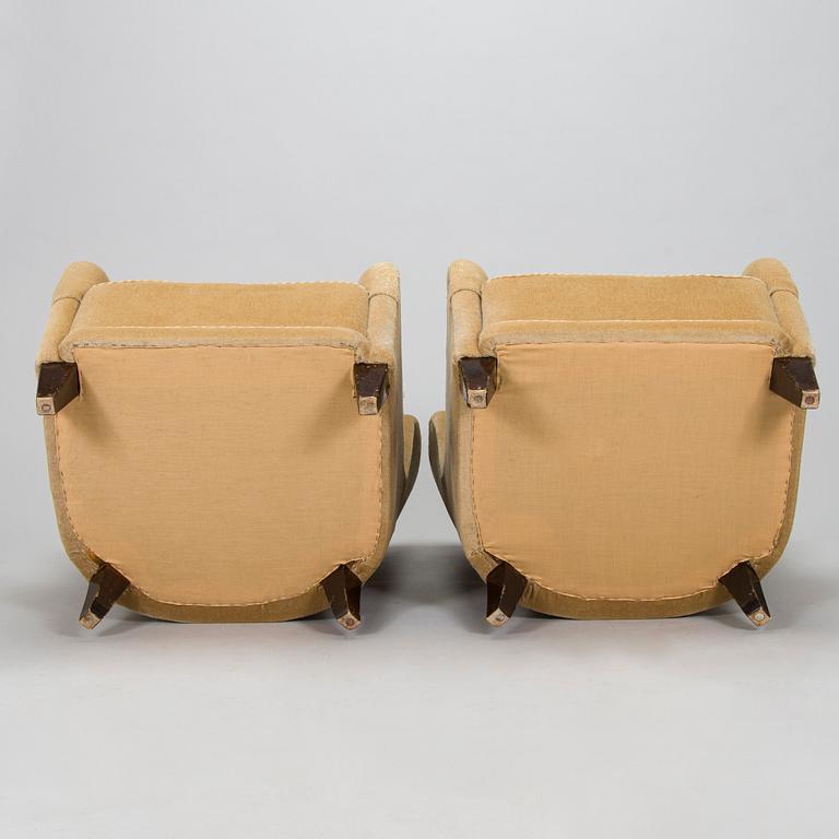 A pair of mid-20th century armchairs.