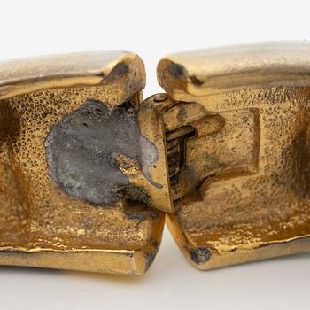 Niki de Saint Phalle , armband, "serpentine bracelet" guldfärgad metall med emalj.