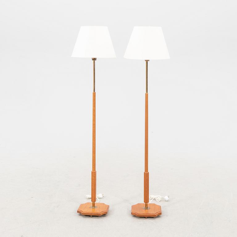 A pair of 1960s teak floor lamps.