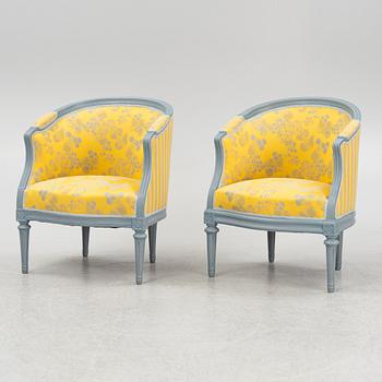 A painted sofa, table, a pair of chairs, a pair of armchairs, a pair of stools, Gustavian style, 20th Century.