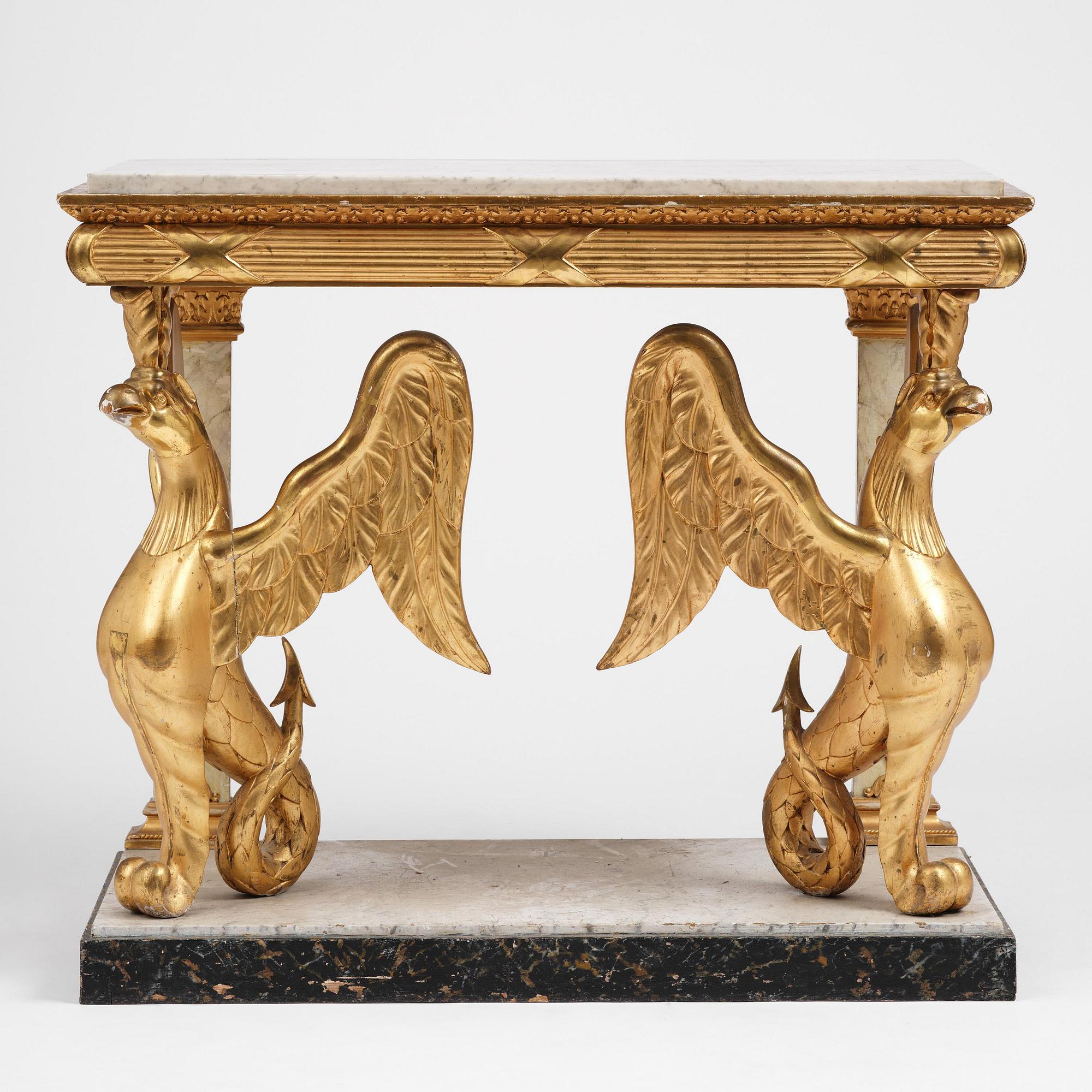 A Swedish Empire gilt wood and white marbel console table.