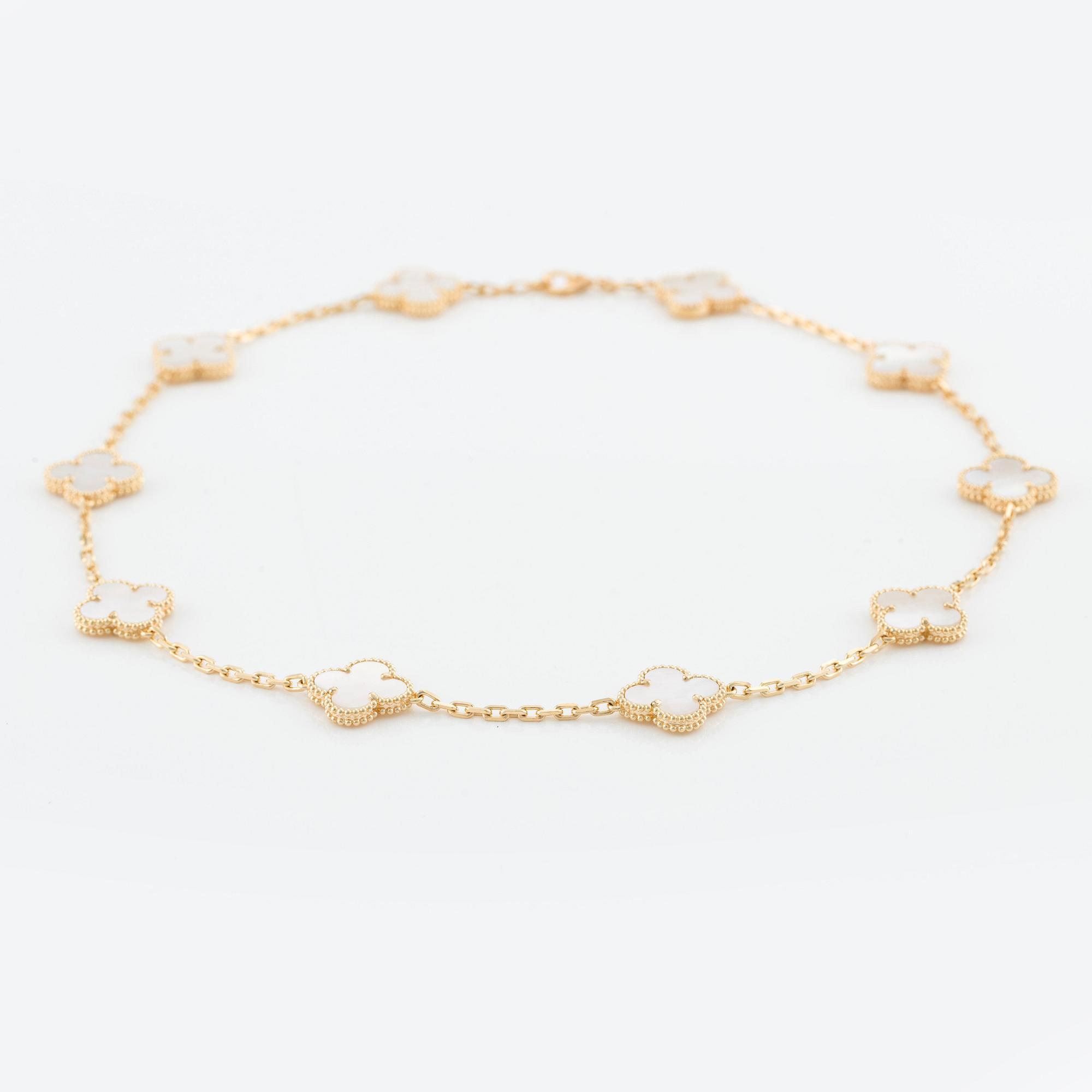 An 18K gold and mother-of-pearl Van Cleef & Arpels "Alhambra" necklace.