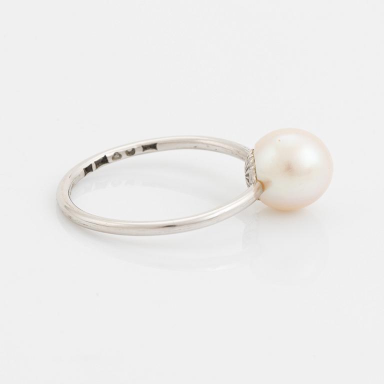 White gold earrings and ring with pearl and white stones.