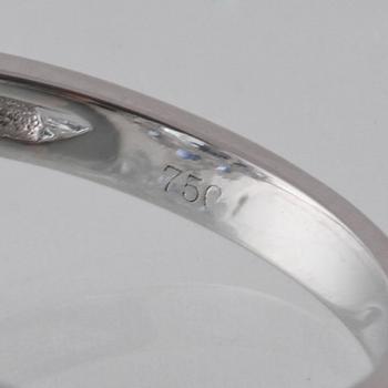 RING, 18K vitguld med briljantslipade diamanter ca 0.24 ct, blå safirer ca 2.05 ct samt topas ca 6.93 ct. Vikt 5,6 g.