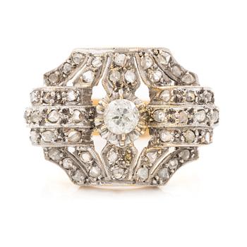 Ring in 18K gold and platinum set with an old-cut diamond and rose-cut diamonds.