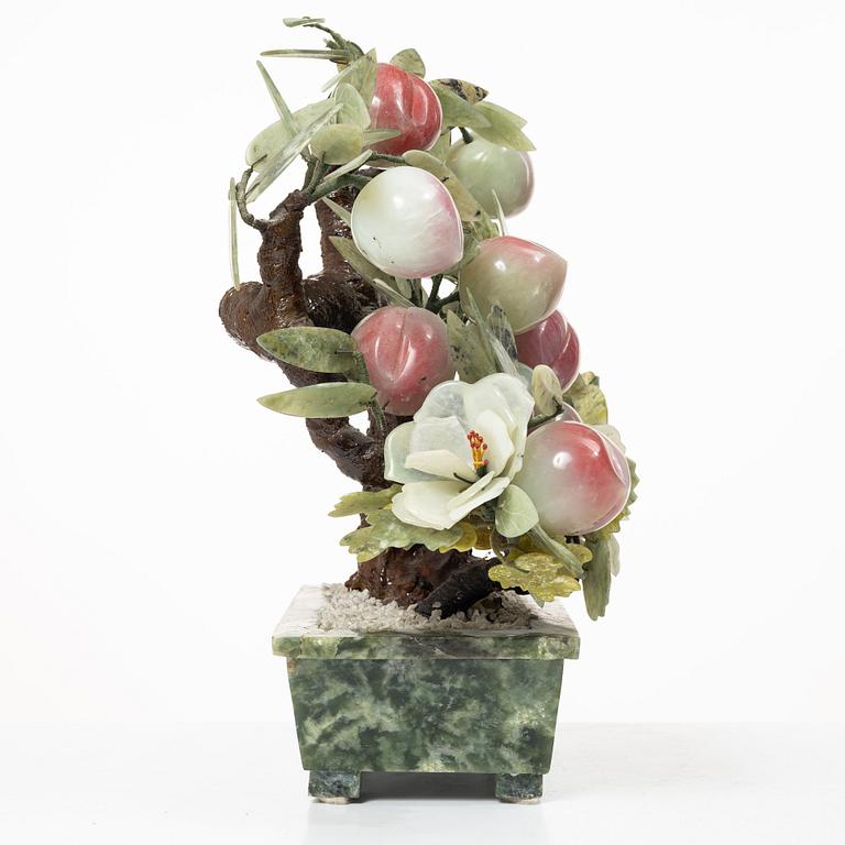 A stone table decoration in the shape of a peach tree, China, 20th century.