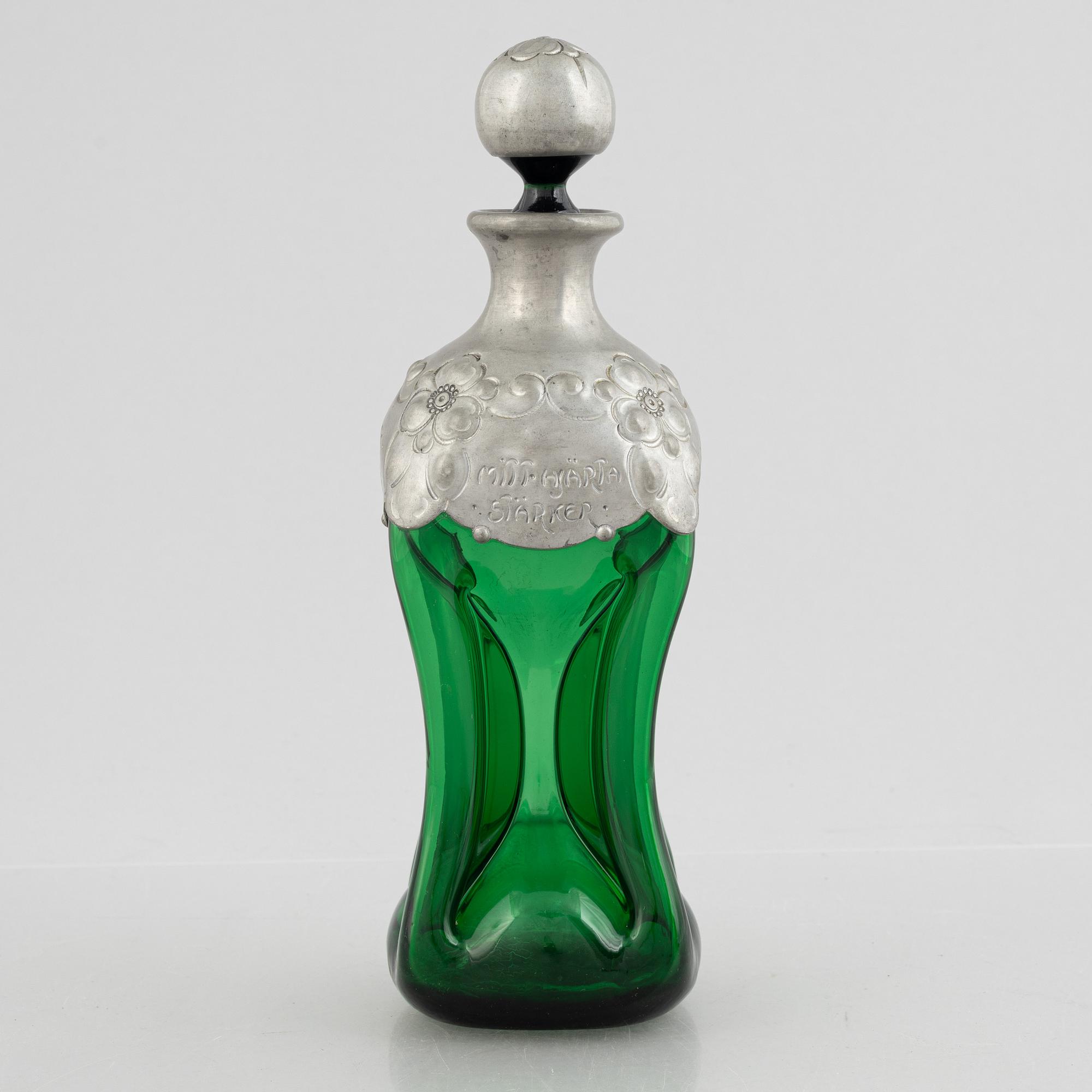 A green glass bottle with stopper, Sweden, early 20th century.
