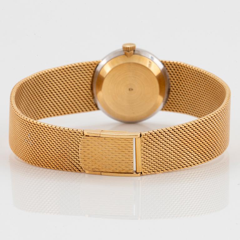 A Chopard wrist watch in 18K gold set with eight-cut diamonds.