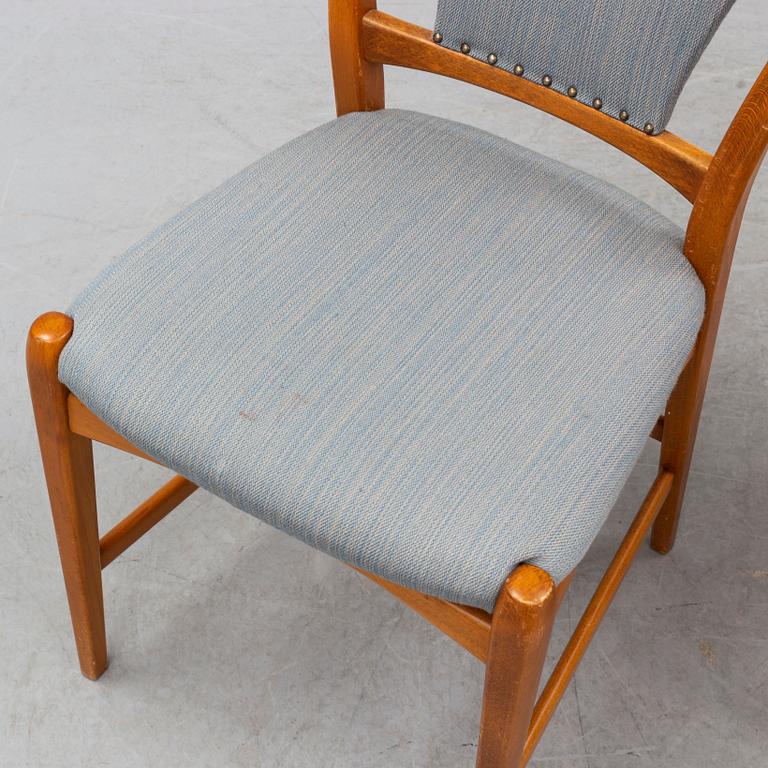 A teak and beech dining table and 6 chairs. Mid 20th century.