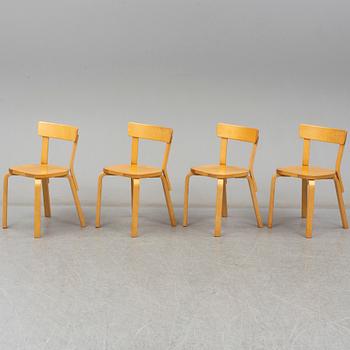 ALVAR AALTO, a table with four model 69 chairs, Artek.