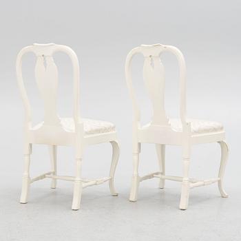 A Rococo style dining table with eight chairs, second half of the 20th century.