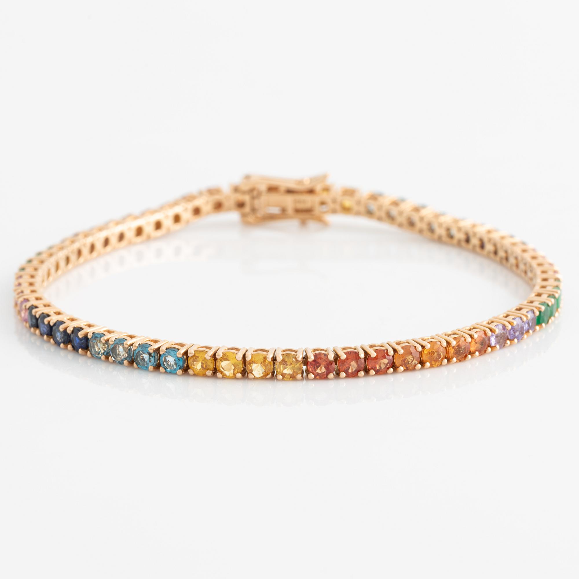 Bracelet 18K gold with faceted emeralds and sapphires in various colors.