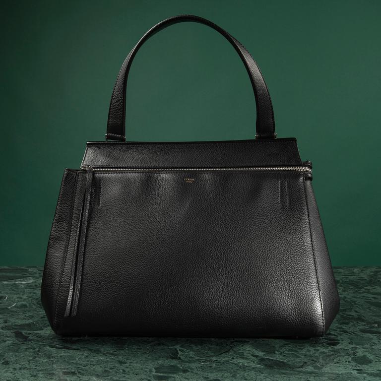 HANDBAG, "Large Edge Bag", Céline, 2013. Black leather with silver-tone hardware, pocket at back with snap closure.