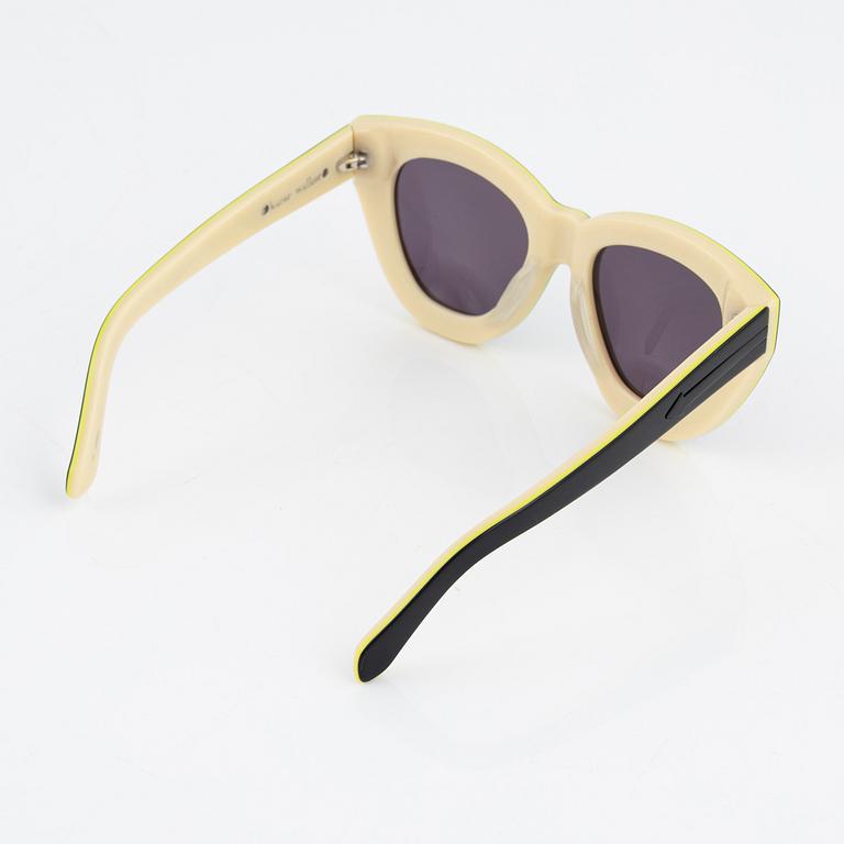 Karen Walker, a pair of "Anytime" sunglasses.