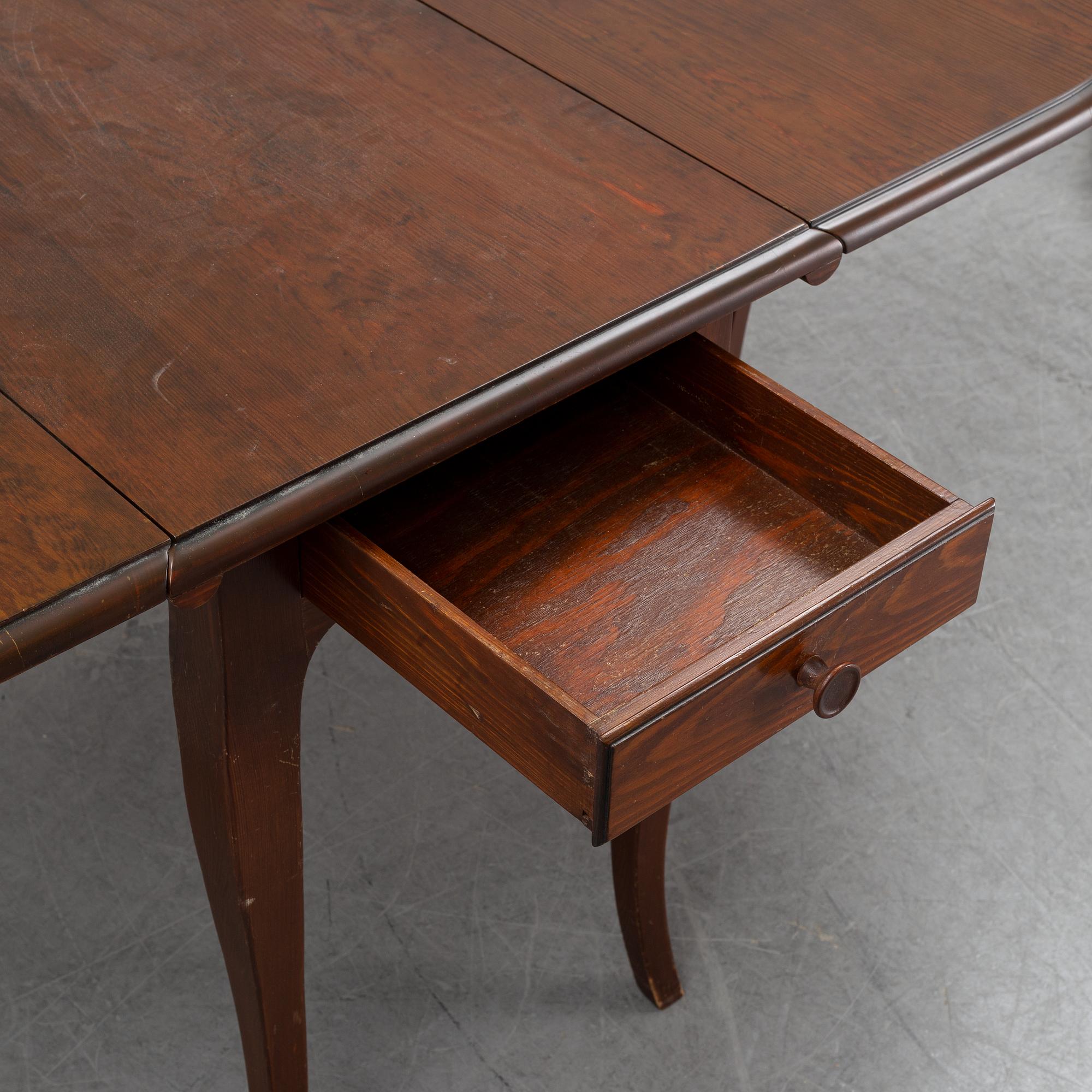 A stained pine gate-leg table, Åmells möbler.