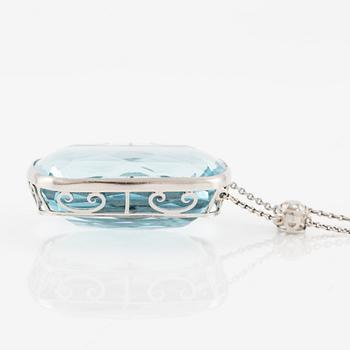 A platinum necklace with a faceted aquamarine and an oval old-cut diamond.